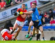 26 March 2023; Conor Grimes of Louth is tackled by Tom Lahiff of Dublin during the Allianz Football League Division 2 match between Dublin and Louth at Croke Park in Dublin. Photo by Ray McManus/Sportsfile