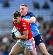 26 March 2023; Dáire McConnon of Louth is tackled by Paddy Small of Dublin during the Allianz Football League Division 2 match between Dublin and Louth at Croke Park in Dublin. Photo by Ray McManus/Sportsfile