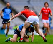 26 March 2023; Cormac Costello of Dublin is tackled by Dan Corcoran of Louth during the Allianz Football League Division 2 match between Dublin and Louth at Croke Park in Dublin. Photo by Ray McManus/Sportsfile