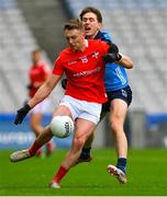 26 March 2023; Ryan Burns of Louth is tackled by Michael Fitzsimons of Dublin during the Allianz Football League Division 2 match between Dublin and Louth at Croke Park in Dublin. Photo by Ray McManus/Sportsfile