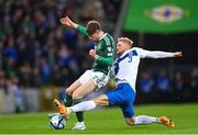 26 March 2023; Conor Bradley of Northern Ireland is tackled Richard Jensen of Finland during the UEFA EURO 2024 Championship Qualifier match between Northern Ireland and Finland at National Stadium at Windsor Park in Belfast. Photo by Ramsey Cardy/Sportsfile
