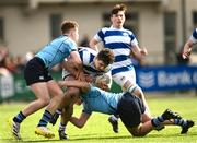 27 March 2023; Tom Keaveney of Blackrock College is tackled by Haydn Gallagher and Joe Kennedy of St Michael’s College during the Bank of Ireland Leinster Rugby Schools Junior Cup Final match between St Michael's College and Blackrock College at Energia Park in Dublin. Photo by Harry Murphy/Sportsfile