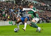 26 March 2023; Glen Kamara of Finland in action against Conor Bradley of Northern Ireland during the UEFA EURO 2024 Championship Qualifier match between Northern Ireland and Finland at National Stadium at Windsor Park in Belfast. Photo by Ramsey Cardy/Sportsfile
