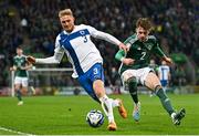 26 March 2023; Richard Jensen of Finland in action against Conor Bradley of Northern Ireland during the UEFA EURO 2024 Championship Qualifier match between Northern Ireland and Finland at National Stadium at Windsor Park in Belfast. Photo by Ramsey Cardy/Sportsfile