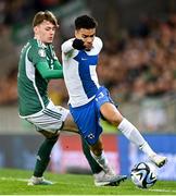 26 March 2023; Pyry Soiri of Finland in action against Conor Bradley of Northern Ireland  during the UEFA EURO 2024 Championship Qualifier match between Northern Ireland and Finland at National Stadium at Windsor Park in Belfast. Photo by Ramsey Cardy/Sportsfile