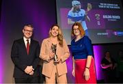 25 March 2023; Aishling Maher of St Vincent's, Dublin is presented with her 2022/23 Team of the Year award by Uachtarán an Cumann Camógaíochta Hilda Breslin, right, and Chief Marketing Officer of AIB, Mark Doyle during the AIB Camogie Club Player Awards 2023 at Croke Park in Dublin. Photo by David Fitzgerald/Sportsfile