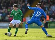 26 March 2023; Kian Leavy of Republic of Ireland in action against Lukas Logi Heimisson of Iceland during the Under-21 international friendly match between Republic of Ireland and Iceland at Turners Cross in Cork. Photo by Seb Daly/Sportsfile