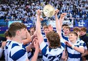 27 March 2023; Gavin Lang of Blackrock College lifts the trophy after his side's victory the Bank of Ireland Leinster Rugby Schools Junior Cup Final match between St Michael's College and Blackrock College at Energia Park in Dublin. Photo by Harry Murphy/Sportsfile