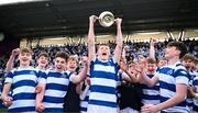 27 March 2023; Luke Coffey of Blackrock College lifts the trophy after his side's victory in the Bank of Ireland Leinster Rugby Schools Junior Cup Final match between St Michael's College and Blackrock College at Energia Park in Dublin. Photo by Harry Murphy/Sportsfile