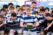 27 March 2023; Blackrock College captain Matthew Wyse prepares to lift the trophy with teammates after his side's victory in the Bank of Ireland Leinster Rugby Schools Junior Cup Final match between St Michael's College and Blackrock College at Energia Park in Dublin. Photo by Harry Murphy/Sportsfile