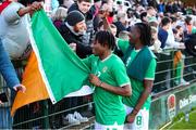 26 March 2023; Republic of Ireland players Tayo Adaramola, left, and Bosun Lawal with supporters after the Under-21 international friendly match between Republic of Ireland and Iceland at Turner's Cross in Cork. Photo by Michael P Ryan/Sportsfile