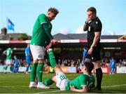 26 March 2023; Andrew Moran of Republic of Ireland receives assistance from teammate Sam Curtis during the Under-21 international friendly match between Republic of Ireland and Iceland at Turner's Cross in Cork. Photo by Michael P Ryan/Sportsfile