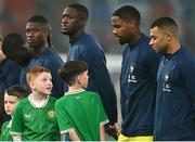 27 March 2023; Mascots turn to look at France captain Kylian Mbappé before the UEFA EURO 2024 Championship Qualifier match between Republic of Ireland and France at Aviva Stadium in Dublin. Photo by Eóin Noonan/Sportsfile