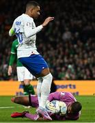 27 March 2023; Republic of Ireland goalkeeper Gavin Bazunu makes a save from Kylian Mbappé of France during the UEFA EURO 2024 Championship Qualifier match between Republic of Ireland and France at Aviva Stadium in Dublin. Photo by Eóin Noonan/Sportsfile