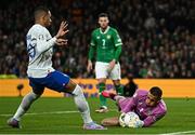 27 March 2023; Republic of Ireland goalkeeper Gavin Bazunu makes a save from Kylian Mbappé of France during the UEFA EURO 2024 Championship Qualifier match between Republic of Ireland and France at Aviva Stadium in Dublin. Photo by Eóin Noonan/Sportsfile