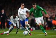 27 March 2023; Matt Doherty of Republic of Ireland in action against Benjamin Pavard of France during the UEFA EURO 2024 Championship Qualifier match between Republic of Ireland and France at Aviva Stadium in Dublin. Photo by Stephen McCarthy/Sportsfile