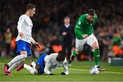 27 March 2023; Matt Doherty of Republic of Ireland in action against Randal Kolo Muani, centre, and Benjamin Pavard of France during the UEFA EURO 2024 Championship Qualifier match between Republic of Ireland and France at Aviva Stadium in Dublin. Photo by Stephen McCarthy/Sportsfile