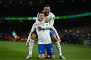 27 March 2023; Benjamin Pavard of France, left, celebrates with team-mate Kylian Mbappé after scoring their side's first goal during the UEFA EURO 2024 Championship Qualifier match between Republic of Ireland and France at Aviva Stadium in Dublin. Photo by Eóin Noonan/Sportsfile