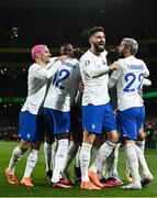 27 March 2023; France players including Olivier Giroud, centre, celebrate their side's first goal, scored by Benjamin Pavard during the UEFA EURO 2024 Championship Qualifier match between Republic of Ireland and France at Aviva Stadium in Dublin. Photo by Eóin Noonan/Sportsfile