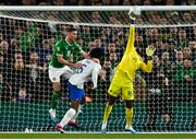 27 March 2023; Alan Browne of Republic of Ireland and Jules Koundé of France look on as France goalkeeper Mike Maignan makes a save during the UEFA EURO 2024 Championship Qualifier match between Republic of Ireland and France at Aviva Stadium in Dublin. Photo by Eóin Noonan/Sportsfile