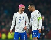 27 March 2023; France players Antoine Griezmann, left, and Kylian Mbappé after their side's victory in the UEFA EURO 2024 Championship Qualifier match between Republic of Ireland and France at Aviva Stadium in Dublin. Photo by Eóin Noonan/Sportsfile