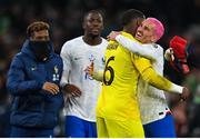 27 March 2023; France goalkeeper Mike Maignan celebrates with  Antoine Griezmann, right, after the UEFA EURO 2024 Championship Qualifier match between Republic of Ireland and France at Aviva Stadium in Dublin. Photo by Seb Daly/Sportsfile
