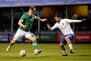 28 March 2023; Thomas Lonergan of Republic of Ireland in action against Zisis Tsikos of Greece during the UEFA European Under-19 Championship Elite Round match between Greece and Republic of Ireland at Ferrycarrig Park in Wexford. Photo by Stephen McCarthy/Sportsfile
