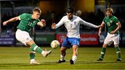 28 March 2023; Thomas Lonergan of Republic of Ireland in action against Zisis Tsikos of Greece during the UEFA European Under-19 Championship Elite Round match between Greece and Republic of Ireland at Ferrycarrig Park in Wexford. Photo by Stephen McCarthy/Sportsfile