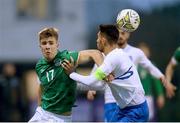 28 March 2023; Thomas Lonergan of Republic of Ireland in action against Alexios Kalogeropoulos of Greece during the UEFA European Under-19 Championship Elite Round match between Greece and Republic of Ireland at Ferrycarrig Park in Wexford. Photo by Stephen McCarthy/Sportsfile