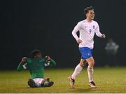 28 March 2023; Nikolaos Deligiannis of Greece celebrates as Franco Umeh of Republic of Ireland reacts to his side's defeat in the UEFA European Under-19 Championship Elite Round match between Greece and Republic of Ireland at Ferrycarrig Park in Wexford. Photo by Stephen McCarthy/Sportsfile