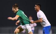 28 March 2023; Thomas Lonergan of Republic of Ireland has his jersey pulled by Dimitrios Keramitsis of Greece during the UEFA European Under-19 Championship Elite Round match between Greece and Republic of Ireland at Ferrycarrig Park in Wexford. Photo by Stephen McCarthy/Sportsfile