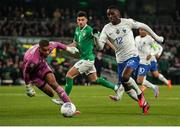 27 March 2023; Randal Kolo Muani of France in action against Republic of Ireland goalkeeper Gavin Bazunu during the UEFA EURO 2024 Championship Qualifier match between Republic of Ireland and France at Aviva Stadium in Dublin. Photo by Michael P Ryan/Sportsfile