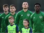 28 March 2023; Republic of Ireland captain James Abankwah and team-mates stand for the playing of the National Anthem before the UEFA European Under-19 Championship Elite Round match between Greece and Republic of Ireland at Ferrycarrig Park in Wexford. Photo by Stephen McCarthy/Sportsfile