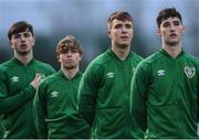 28 March 2023; Republic of Ireland players, from left, Roco Vata, Harry Vaughan, Thomas Lonergan and John Ryan stand for the playing of the National Anthem before the UEFA European Under-19 Championship Elite Round match between Greece and Republic of Ireland at Ferrycarrig Park in Wexford. Photo by Stephen McCarthy/Sportsfile