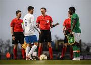 28 March 2023; Referee Sander Van Der Eijk with Greece captain Alexios Kalogeropoulos, left, and Republic of Ireland captain James Abankwah before the UEFA European Under-19 Championship Elite Round match between Greece and Republic of Ireland at Ferrycarrig Park in Wexford. Photo by Stephen McCarthy/Sportsfile