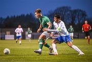 28 March 2023; Thomas Lonergan of Republic of Ireland in action against Alexios Kalogeropoulos of Greece during the UEFA European Under-19 Championship Elite Round match between Greece and Republic of Ireland at Ferrycarrig Park in Wexford. Photo by Stephen McCarthy/Sportsfile