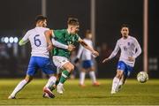 28 March 2023; Thomas Lonergan of Republic of Ireland in action against Alexios Kalogeropoulos of Greece during the UEFA European Under-19 Championship Elite Round match between Greece and Republic of Ireland at Ferrycarrig Park in Wexford. Photo by Stephen McCarthy/Sportsfile