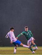 28 March 2023; Alex Murphy of Republic of Ireland in action against Christos Stavropoulos of Greece during the UEFA European Under-19 Championship Elite Round match between Greece and Republic of Ireland at Ferrycarrig Park in Wexford. Photo by Stephen McCarthy/Sportsfile