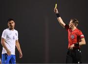 28 March 2023; Dimitrios Keramitsis of Greece is shown a yellow card by referee Sander Van Der Eijk during the UEFA European Under-19 Championship Elite Round match between Greece and Republic of Ireland at Ferrycarrig Park in Wexford. Photo by Stephen McCarthy/Sportsfile
