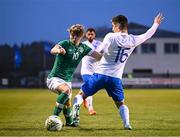 28 March 2023; Harry Vaughan of Republic of Ireland in action against Anastasios Symeonidis of Greece during the UEFA European Under-19 Championship Elite Round match between Greece and Republic of Ireland at Ferrycarrig Park in Wexford. Photo by Stephen McCarthy/Sportsfile