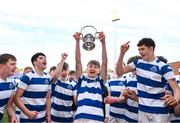 27 March 2023; Rhys Keogh of Blackrock College lifts the trophy after his side's victory in the Bank of Ireland Leinster Rugby Schools Junior Cup Final match between St Michael's College and Blackrock College at Energia Park in Dublin. Photo by Harry Murphy/Sportsfile