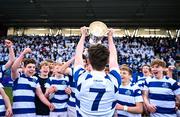 27 March 2023; Tom McAleese of Blackrock College lifts the trophy after his side's victory in the Bank of Ireland Leinster Rugby Schools Junior Cup Final match between St Michael's College and Blackrock College at Energia Park in Dublin. Photo by Harry Murphy/Sportsfile