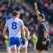 26 March 2023; Referee David Gough issues a yellow card to Darren Hughes of Monaghan during the Allianz Football League Division 1 match between Mayo and Monaghan at Hastings Insurance MacHale Park in Castlebar, Mayo. Photo by Ben McShane/Sportsfile