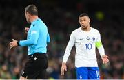 27 March 2023; Kylian Mbappé of France and referee Artur Dias during the UEFA EURO 2024 Championship Qualifier match between Republic of Ireland and France at Aviva Stadium in Dublin. Photo by Stephen McCarthy/Sportsfile