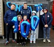 31 March 2023; Young Shelbourne supporters, from left, Olivia Duffy, age 6, Ava O'Rourke age 8, Clara Duffy, age 10, and Warren White, right, hold up balloons congratulating Shelbourne player Luke Byrne behind, on his 100th appearance for the club, alongside Shelbourne manager Damien Duff, before the SSE Airtricity Men's Premier Division match between Shelbourne and Derry City at Tolka Park in Dublin. Photo by Seb Daly/Sportsfile