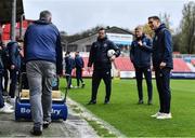 31 March 2023; Anto Breslin of St Patrick's Athletic, right, encourages the groundstaff as they clear the water from the sideline before the SSE Airtricity Men's Premier Division match between St Patrick's Athletic and UCD at Richmond Park in Dublin. Photo by Ben McShane/Sportsfile