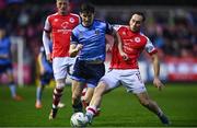 31 March 2023; Dara Keane of UCD in action against Vladislav Kreida of St Patrick's Athletic during the SSE Airtricity Men's Premier Division match between St Patrick's Athletic and UCD at Richmond Park in Dublin. Photo by Ben McShane/Sportsfile