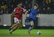 31 March 2023; Ciaran Behan of UCD in action against Vladislav Kreida of St Patrick's Athletic during the SSE Airtricity Men's Premier Division match between St Patrick's Athletic and UCD at Richmond Park in Dublin. Photo by Ben McShane/Sportsfile