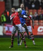 31 March 2023; Jason McClelland of St Patrick's Athletic in action against Daniel Norris of UCD during the SSE Airtricity Men's Premier Division match between St Patrick's Athletic and UCD at Richmond Park in Dublin. Photo by Ben McShane/Sportsfile