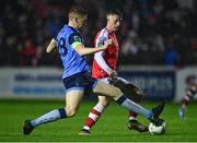 31 March 2023; Chris Forrester of St Patrick's Athletic in action against Jack Keaney of UCD during the SSE Airtricity Men's Premier Division match between St Patrick's Athletic and UCD at Richmond Park in Dublin. Photo by Ben McShane/Sportsfile
